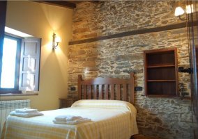 Double bedroom with towels on the bedspread