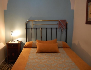 Double bedroom with double bed in the rural house in orange