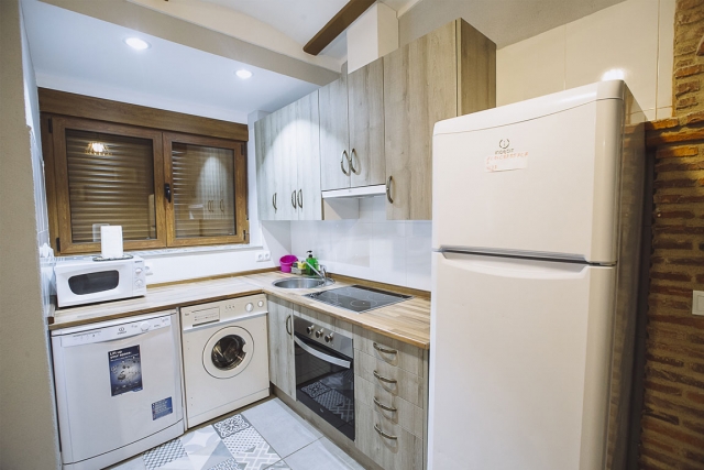 Cocina con encimera en L