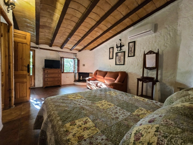 Dormitorio con chimenea 