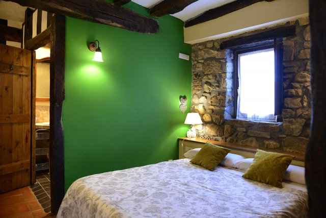Dormitorio en tonos verdes