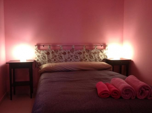 Dormitorio de matrimonio en rosa