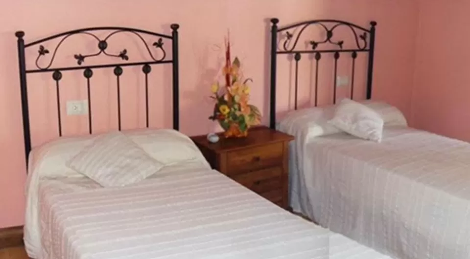 Dormitorio doble con camas independientes