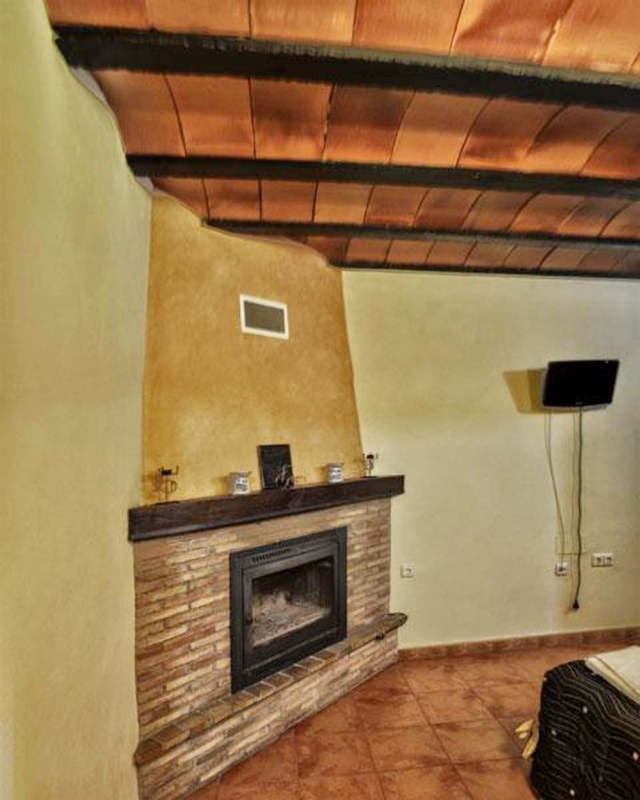 Dormitorio y chimenea