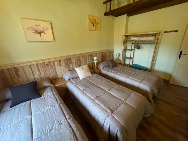 Dormitorio triple con camas 