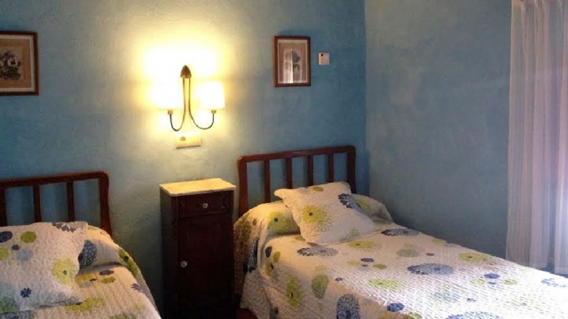 Camas individuales dormitorio azul