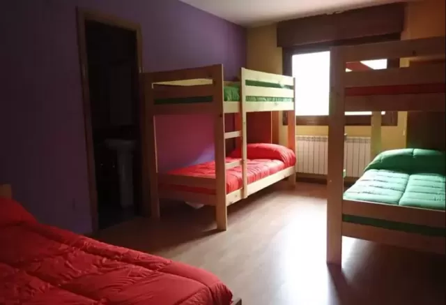 Cama en habitación 12 plazas