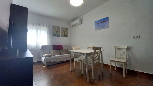 Sala amplia con tele