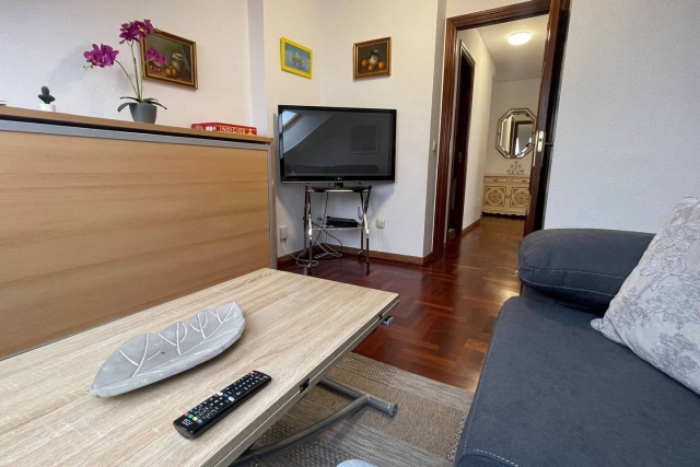 Sala amplia con tele