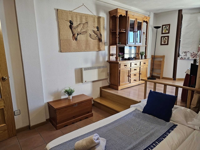 Dormitorio junto a la sala