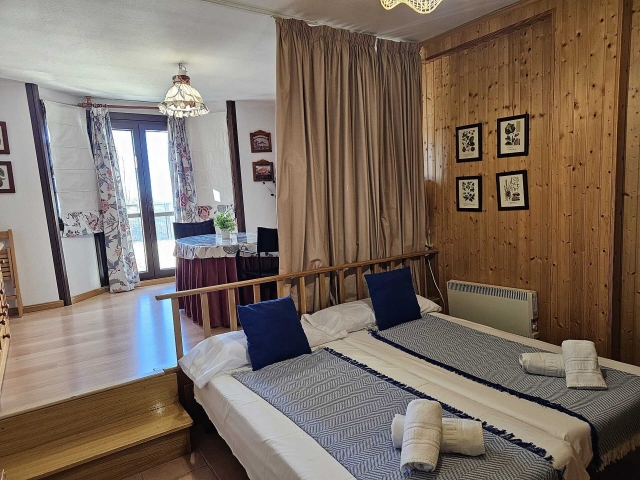 Dormitorio y sala de estar