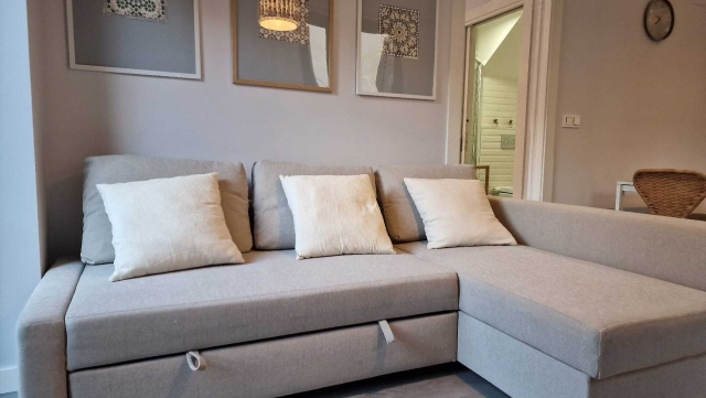 Sala de estar con sofa cama