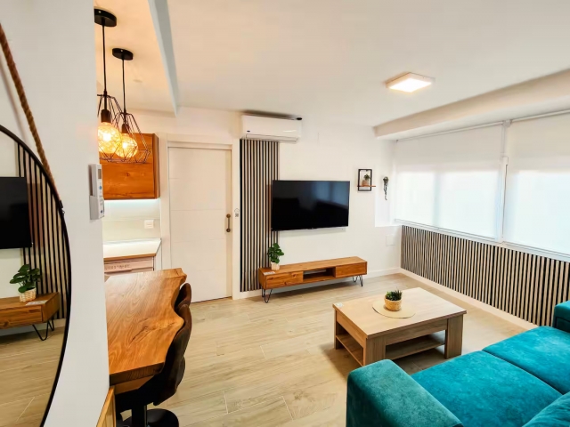 Sala amplia con tele