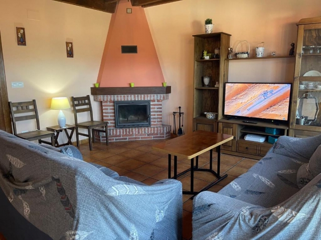 Sala amplia con tele