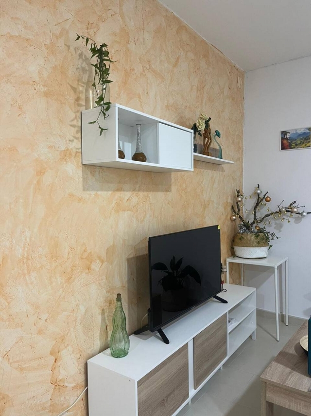 Sala amplia con tele