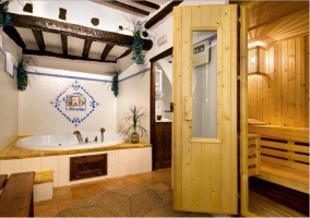 Sala de spa con jacuzzi y sauna