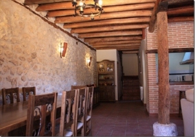 Fireplace in the corner of the living room with armchairs around