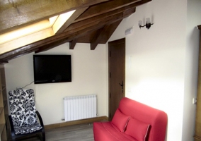 Zona de estar del dormitorio del ático