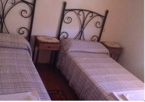 Dos camas individuales de la casa rural